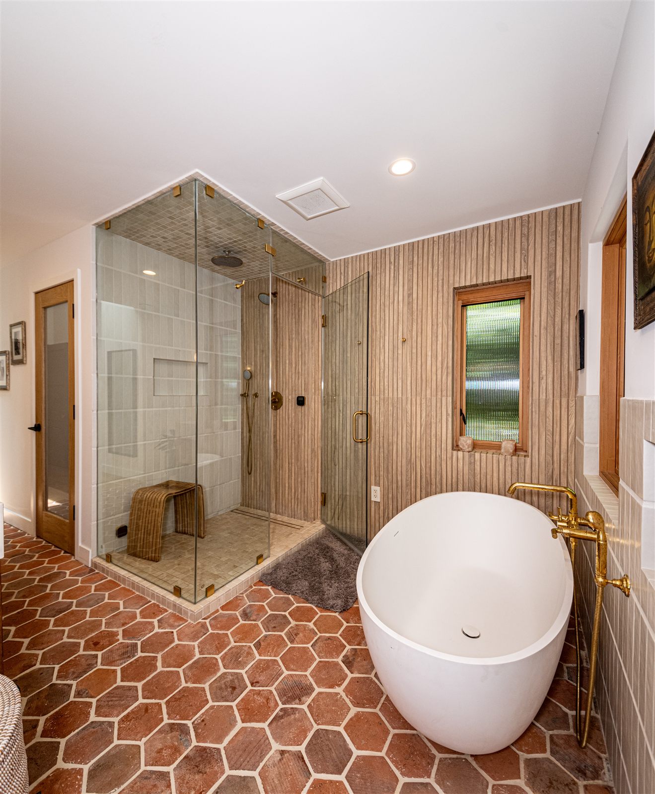 Spa bathroom with freestanding tub and brass tub filler