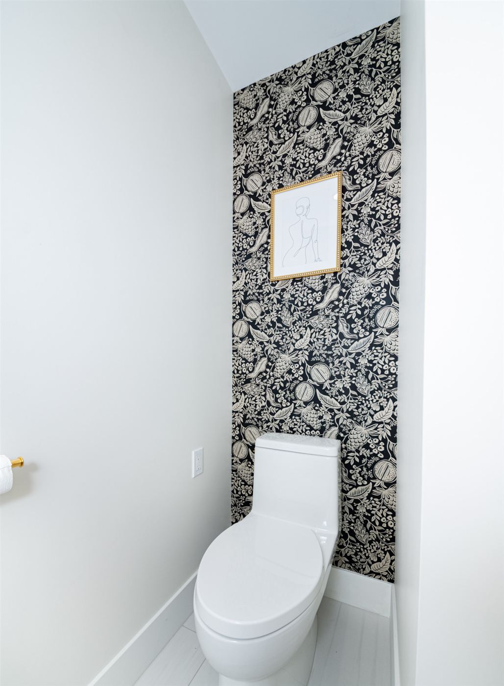 Powder room with black and white wallpaper