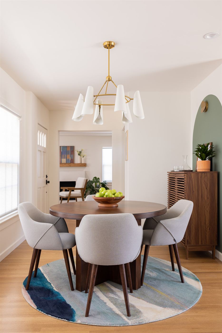 Dining room with mid-century modern round dark wood table