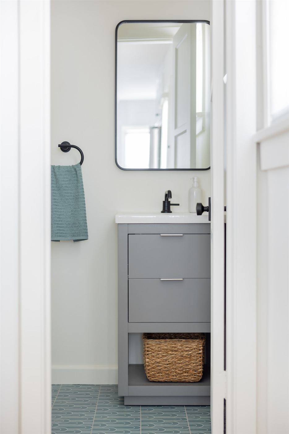 Modern bathroom vanity with grey drawers